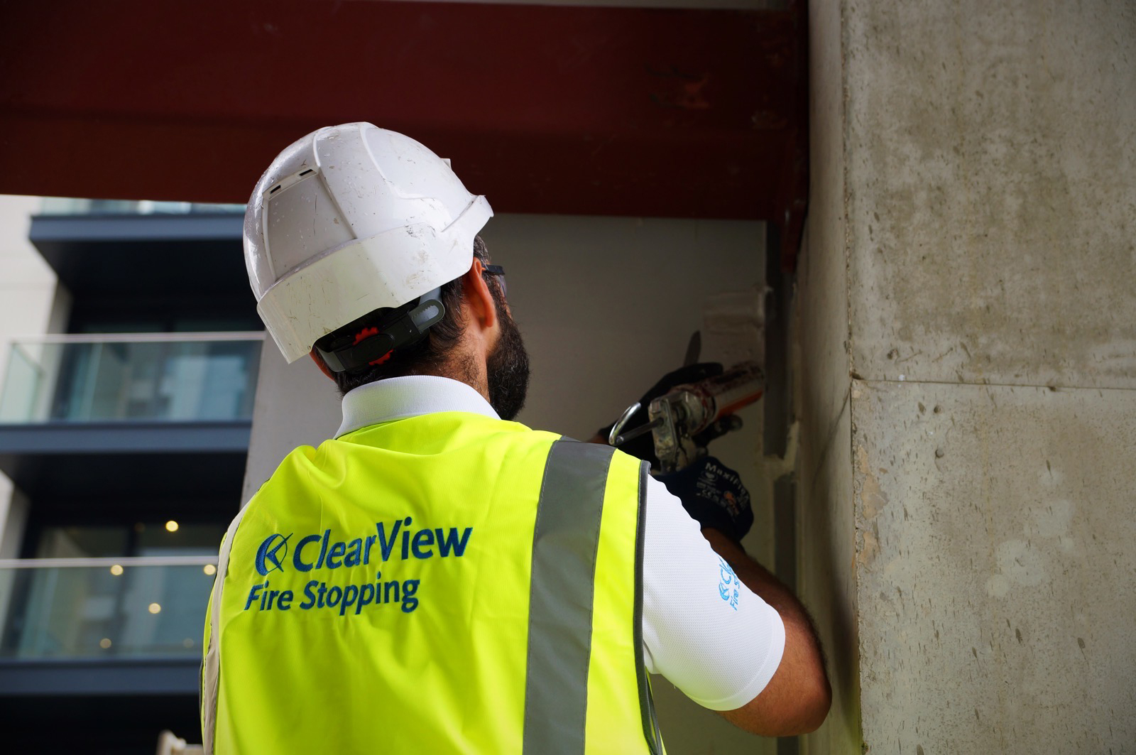 Fire Stopping man doing Installation